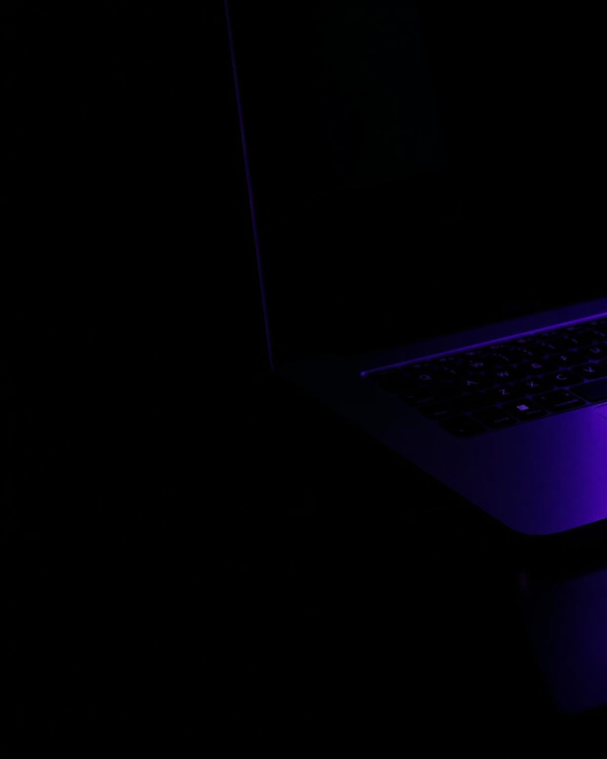 Laptop in low violet light