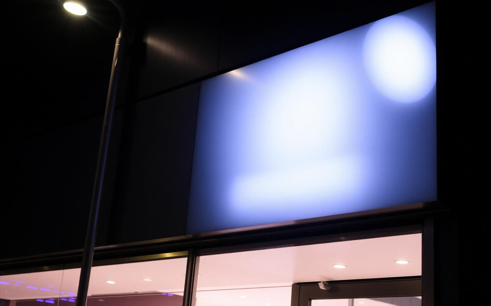 Backlit storefront signage at night